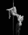 nude-woman-laying-back-on-pole (1).jpg