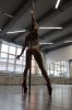 169290013-unrecognizable-woman-performing-alluring-pole-dance.jpg
